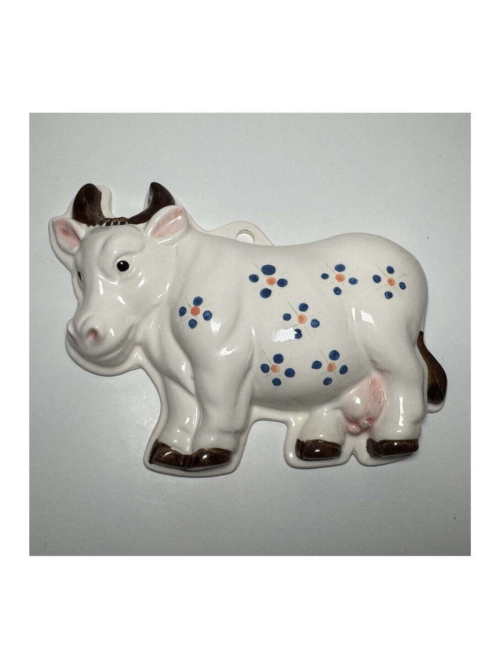 Ceramic Cow Wall Decor with Blue, Orange, and Pink Floral Design